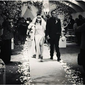 Mr. and Mrs. Kevin Gates walk down the aisle.