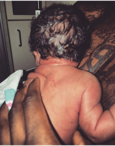 Iman holds his newborn daughter, Iman Tayla Shumpert, Jr. 
